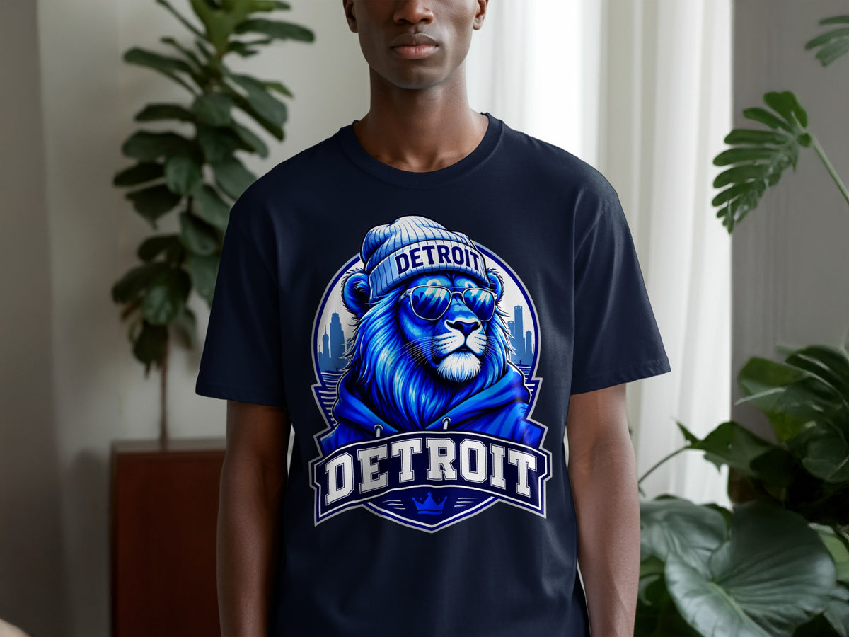 Dark blue t-shirt with a blue lion graphic wearing a beanie and sunglasses with "DETROIT" text.