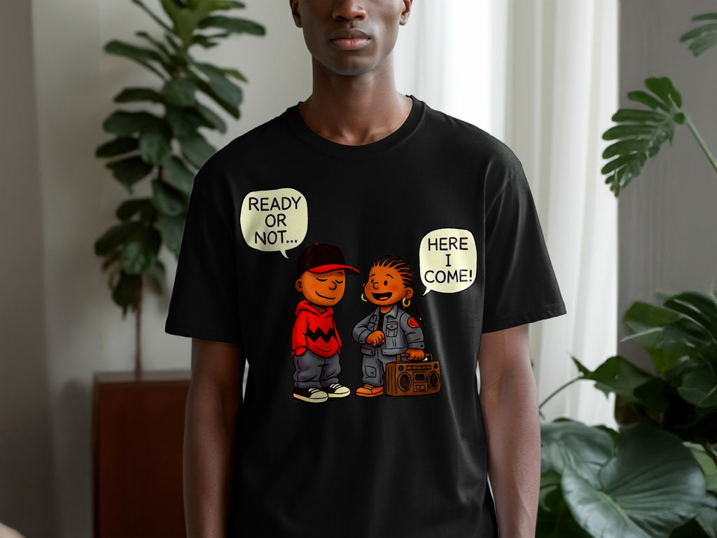 Black t-shirt with cartoon of boy with hat saying "READY OR NOT..." and girl with boombox saying "HERE I COME!".