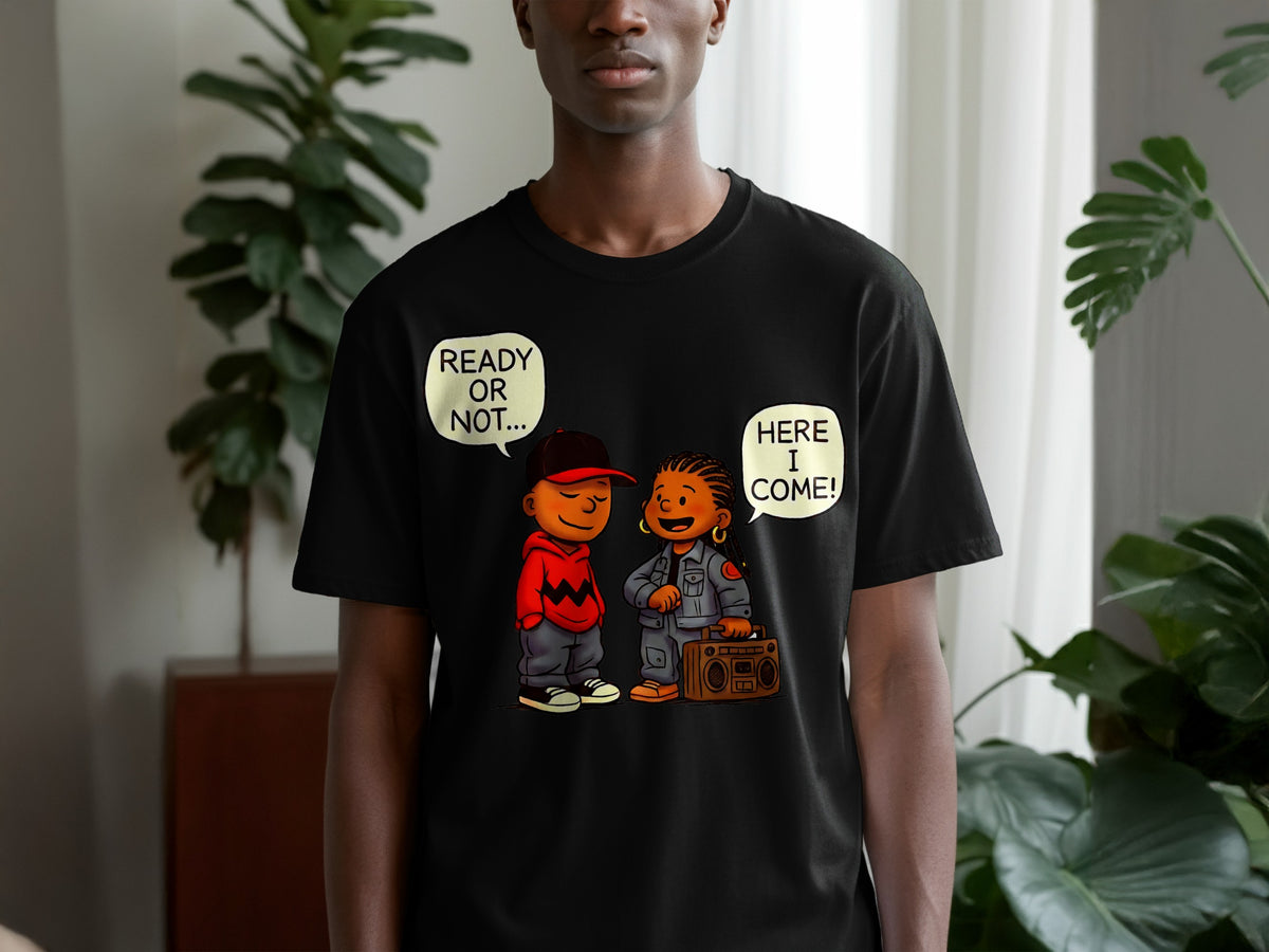 Black t-shirt with cartoon of boy with hat saying "READY OR NOT..." and girl with boombox saying "HERE I COME!".