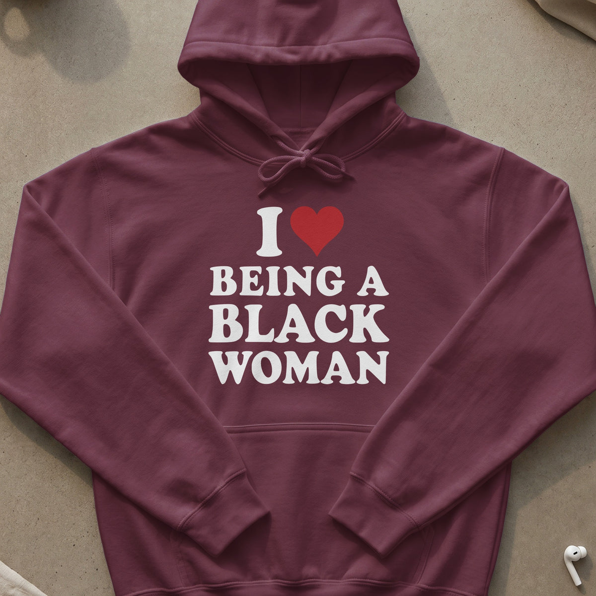 Maroon hoodie with white text and a red heart: "I Love Being A Black Woman"