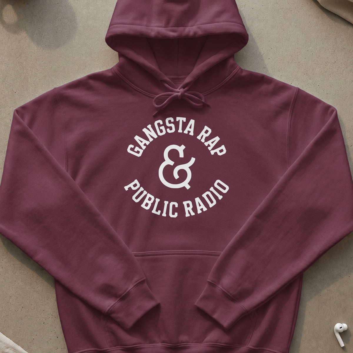 Maroon hoodie with white text "Gangsta Rap & Public Radio" and an ampersand.