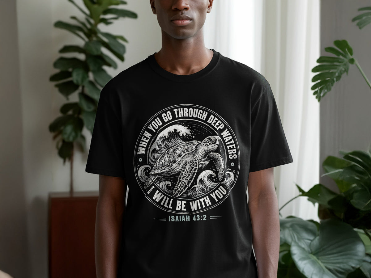 Black t-shirt with a sea turtle and waves graphic, reading "When You Go Through Deep Waters I Will Be With You Isaiah 43:2".