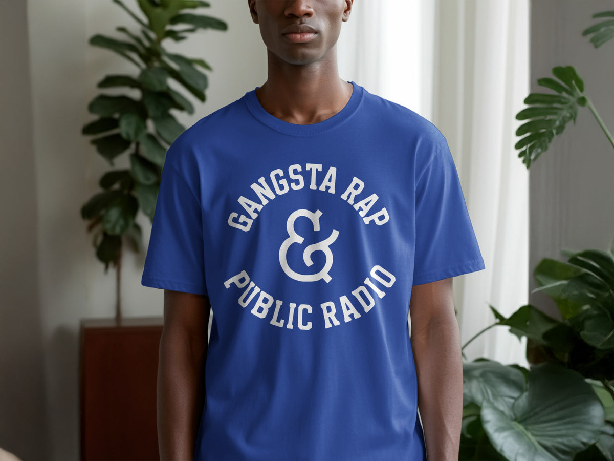 Blue t-shirt with white text "Gangsta Rap & Public Radio" on chest