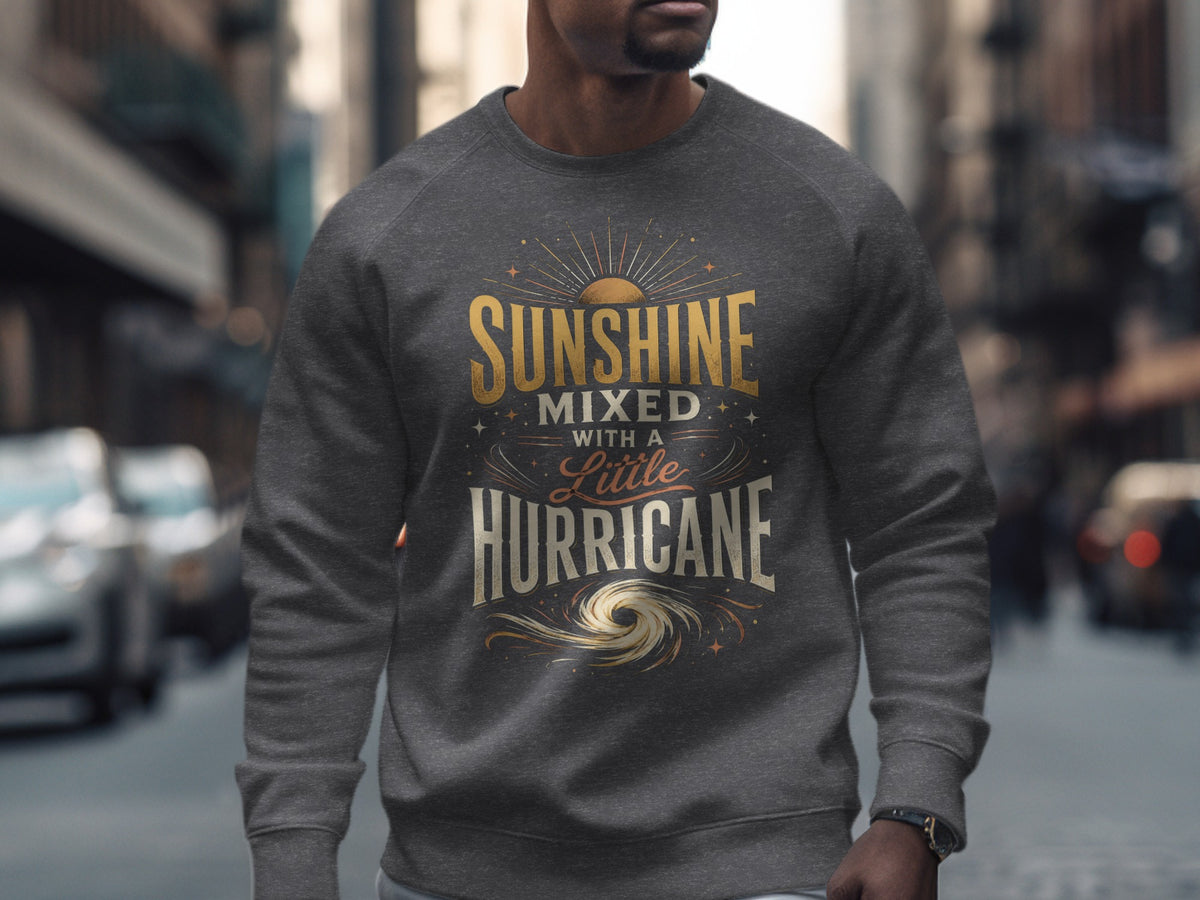 Dark grey sweatshirt with "Sunshine Mixed With A Little Hurricane" text graphic.