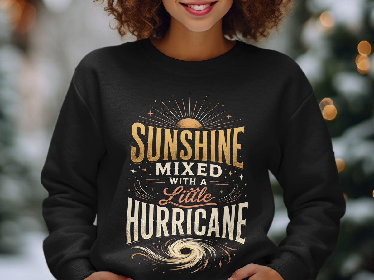 Black sweatshirt with "Sunshine Mixed With A Little Hurricane" text and hurricane graphic.