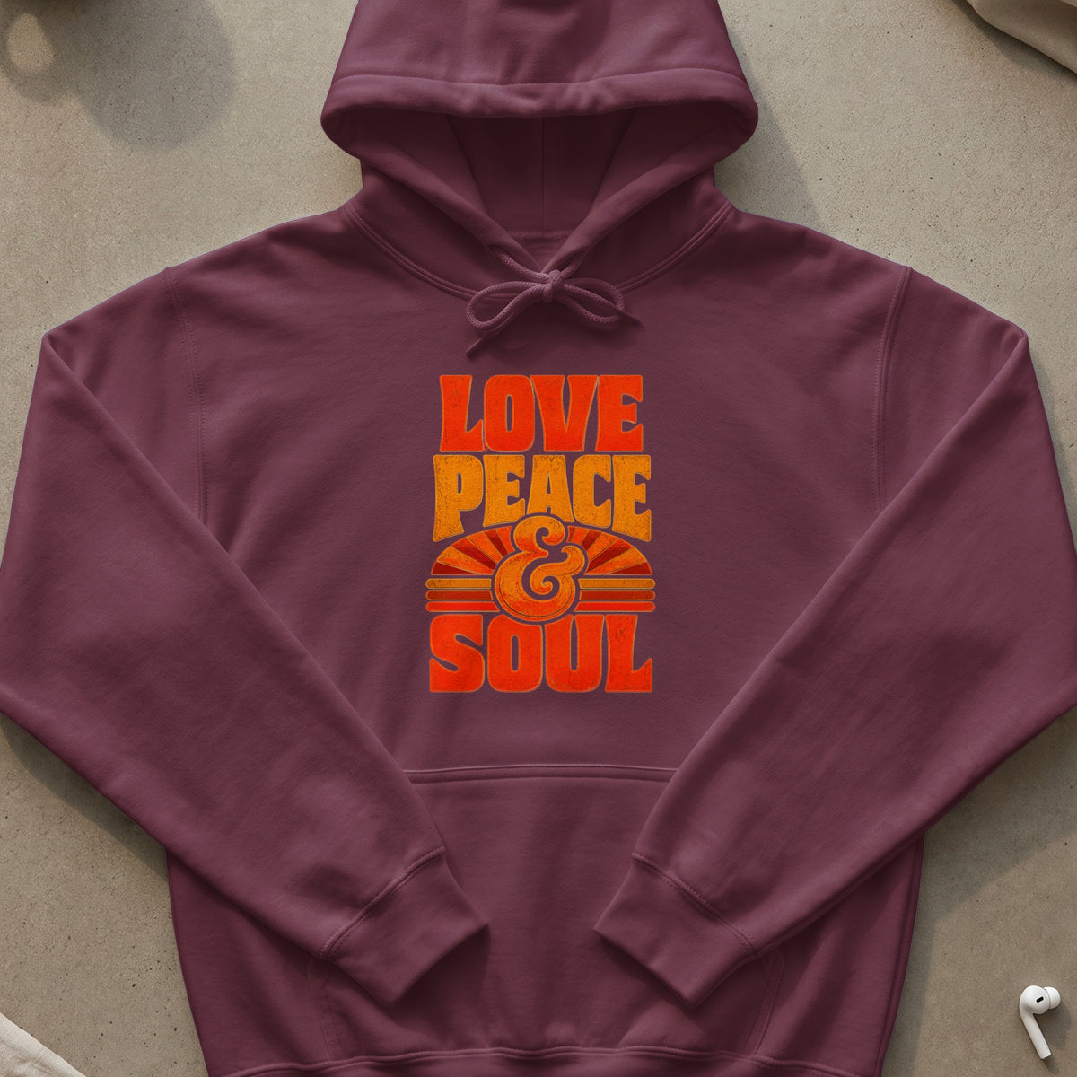 Maroon hoodie with "Love Peace & Soul" graphic in orange and yellow.