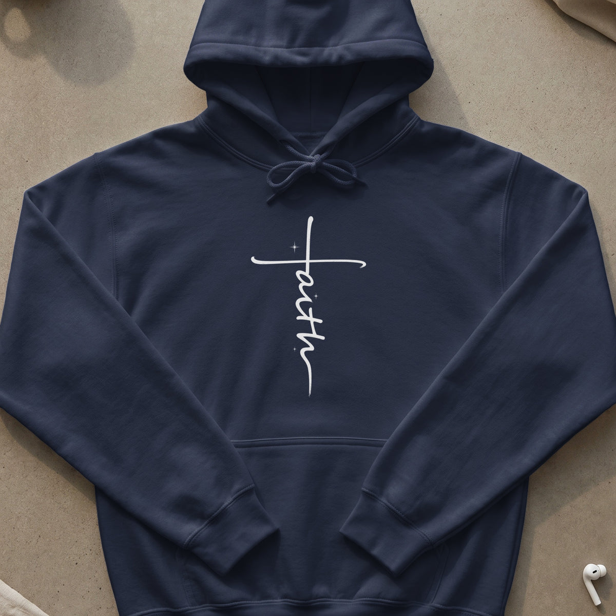 Navy hoodie with a white script "Faith" cross graphic on the chest.