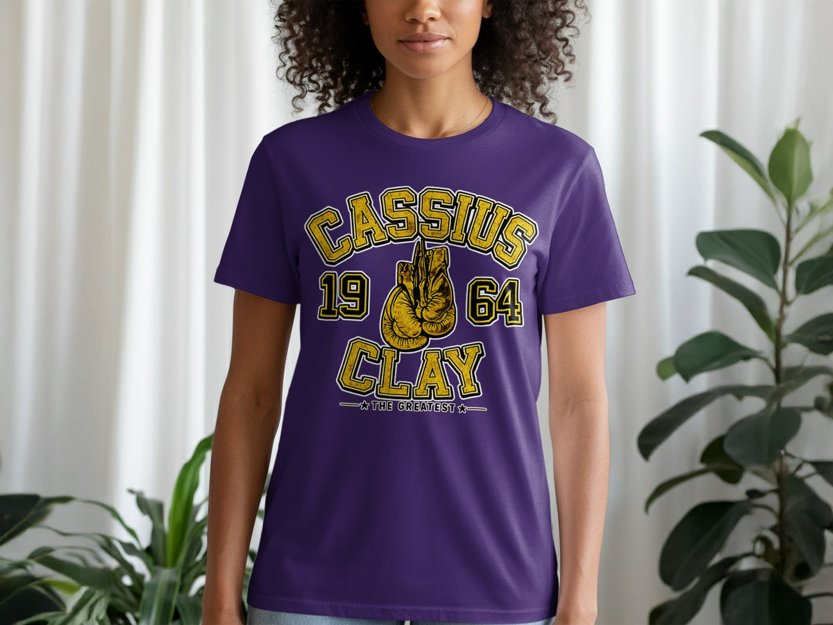 Purple t-shirt with gold text: Cassius 1964 Clay, The Greatest.