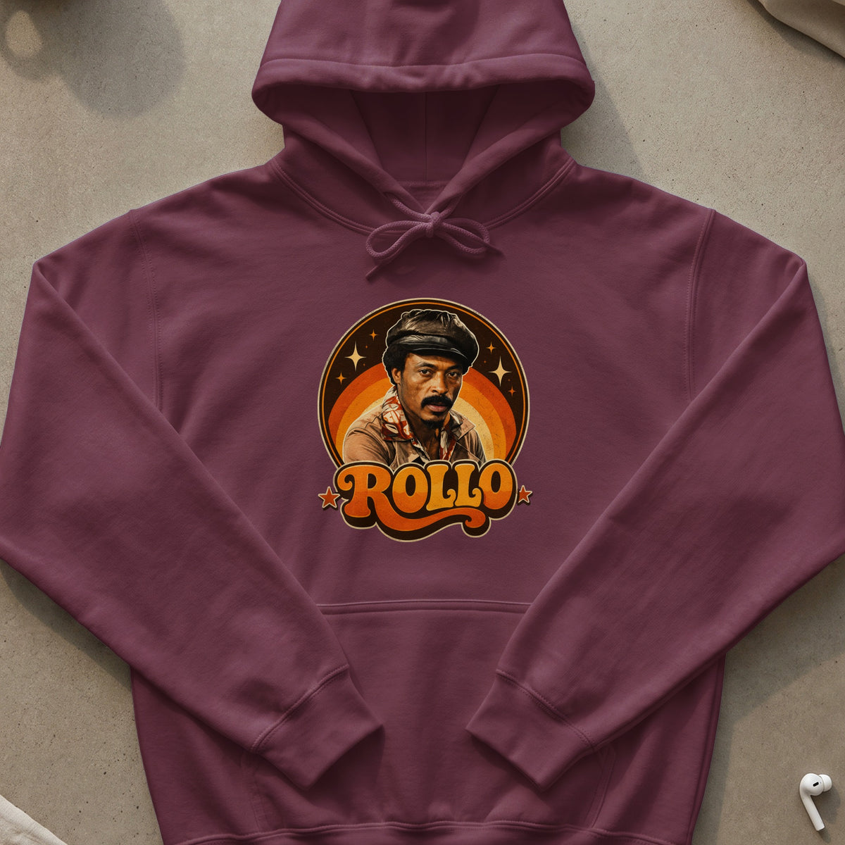 Burgundy hoodie with a graphic of a man and "ROLLO" in a retro style.
