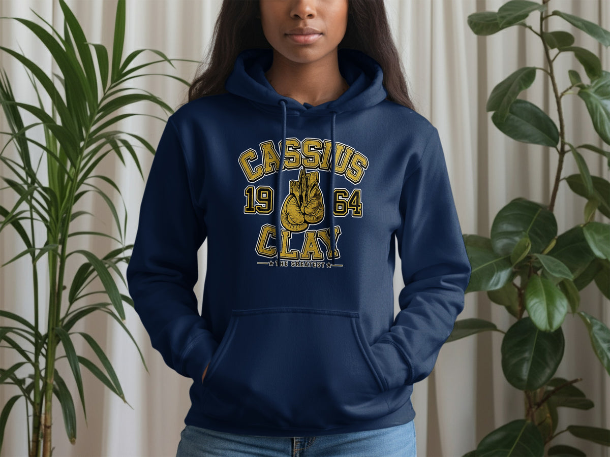 Navy hoodie with "Cassius Clay 1964 The Greatest" and boxing gloves graphic.