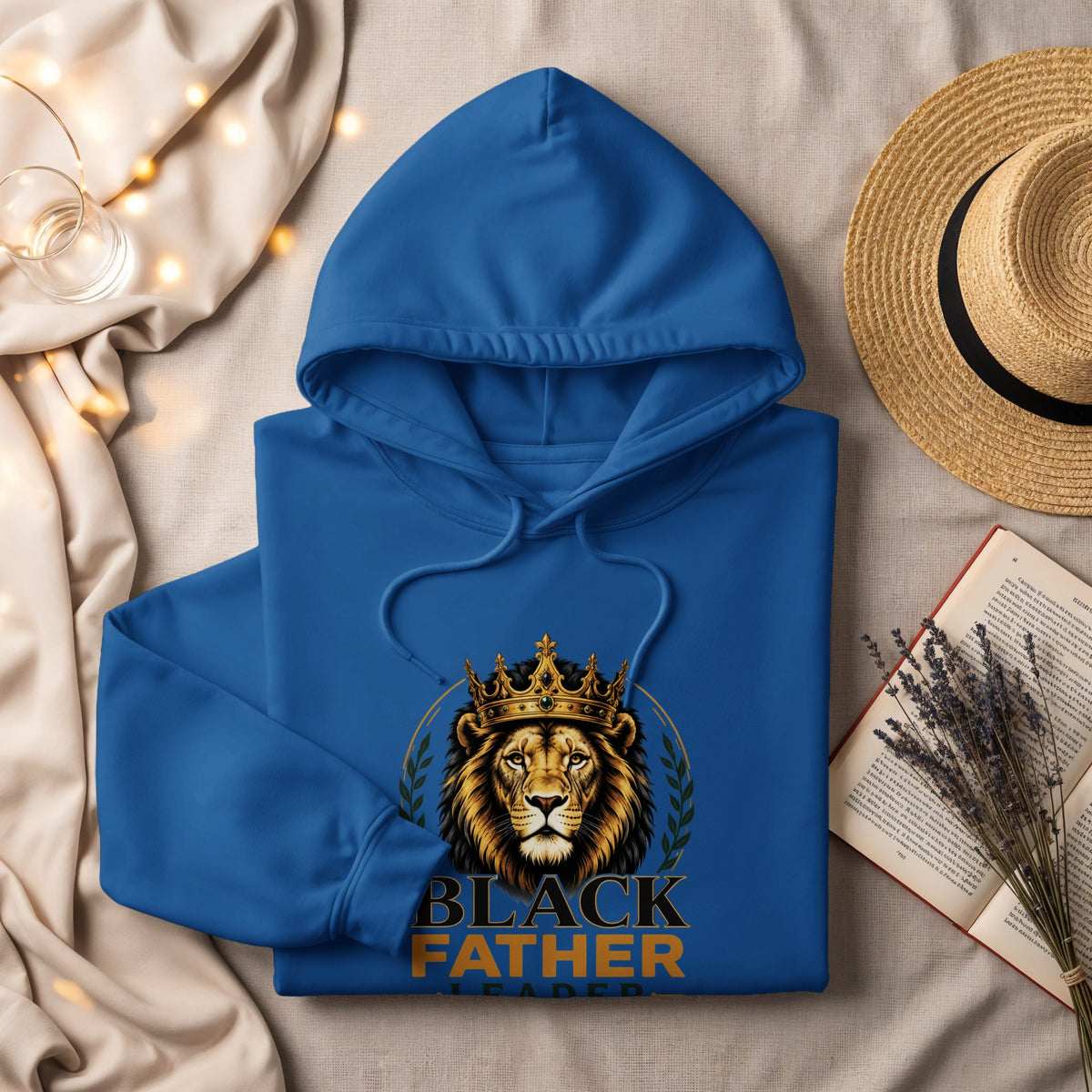 Blue hoodie with lion graphic and text "BLACK FATHER LEADER".