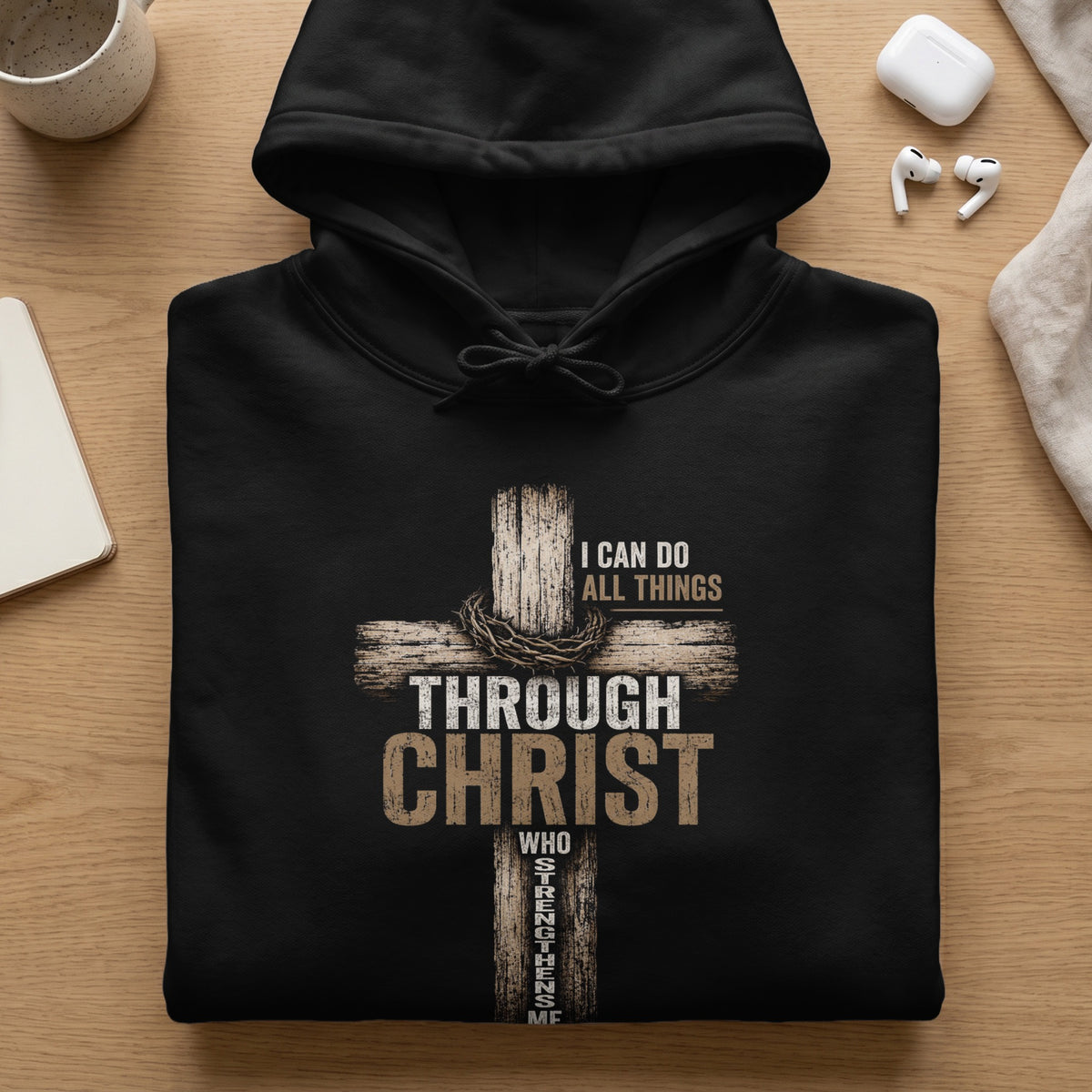 Black hoodie with graphic of cross, crown of thorns, and text "I CAN DO ALL THINGS THROUGH CHRIST WHO STRENGTHENS ME".