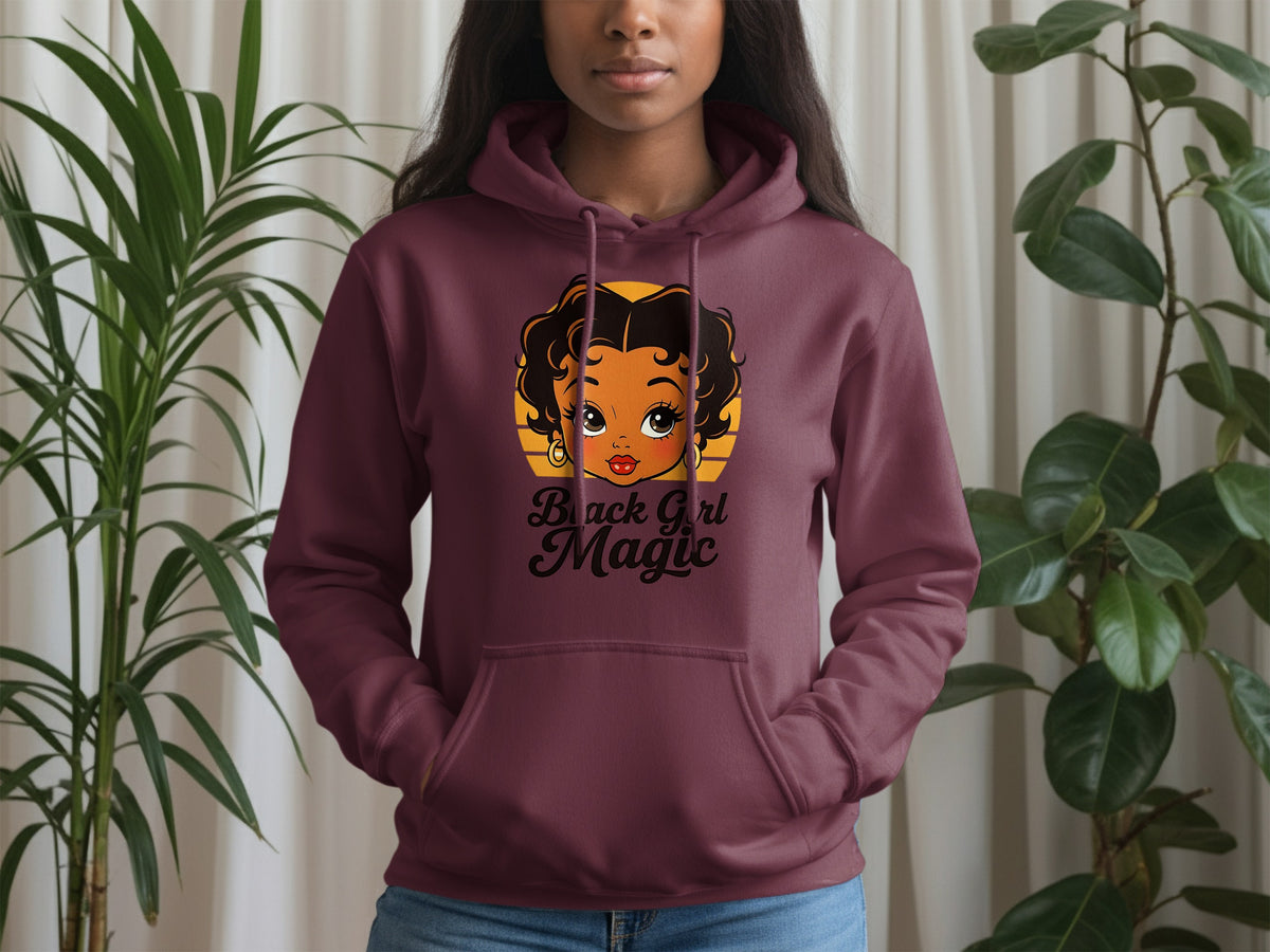 Maroon hoodie with cartoon girl graphic and text "Black Girl Magic".