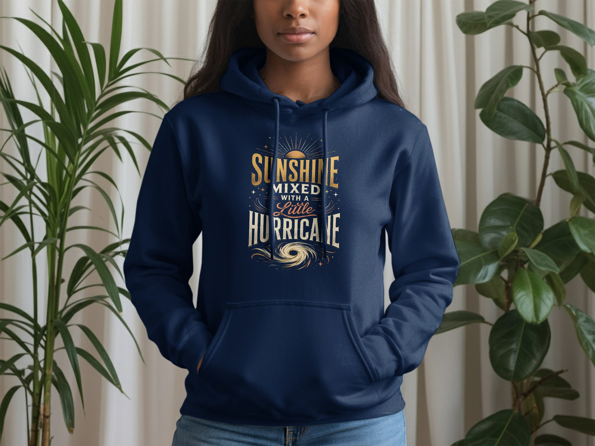 Navy hoodie with gold text "Sunshine Mixed With A Little Hurricane" and sun graphic.