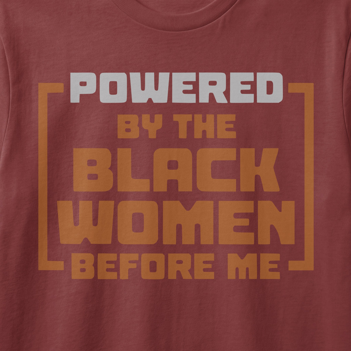Shirt with text "POWERED BY THE BLACK WOMEN BEFORE ME".