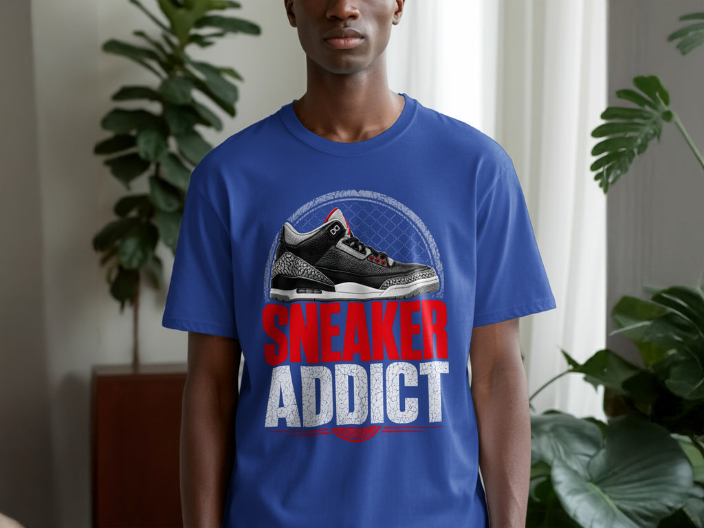 Blue t-shirt with graphic of black and gray sneaker and text "SNEAKER ADDICT".