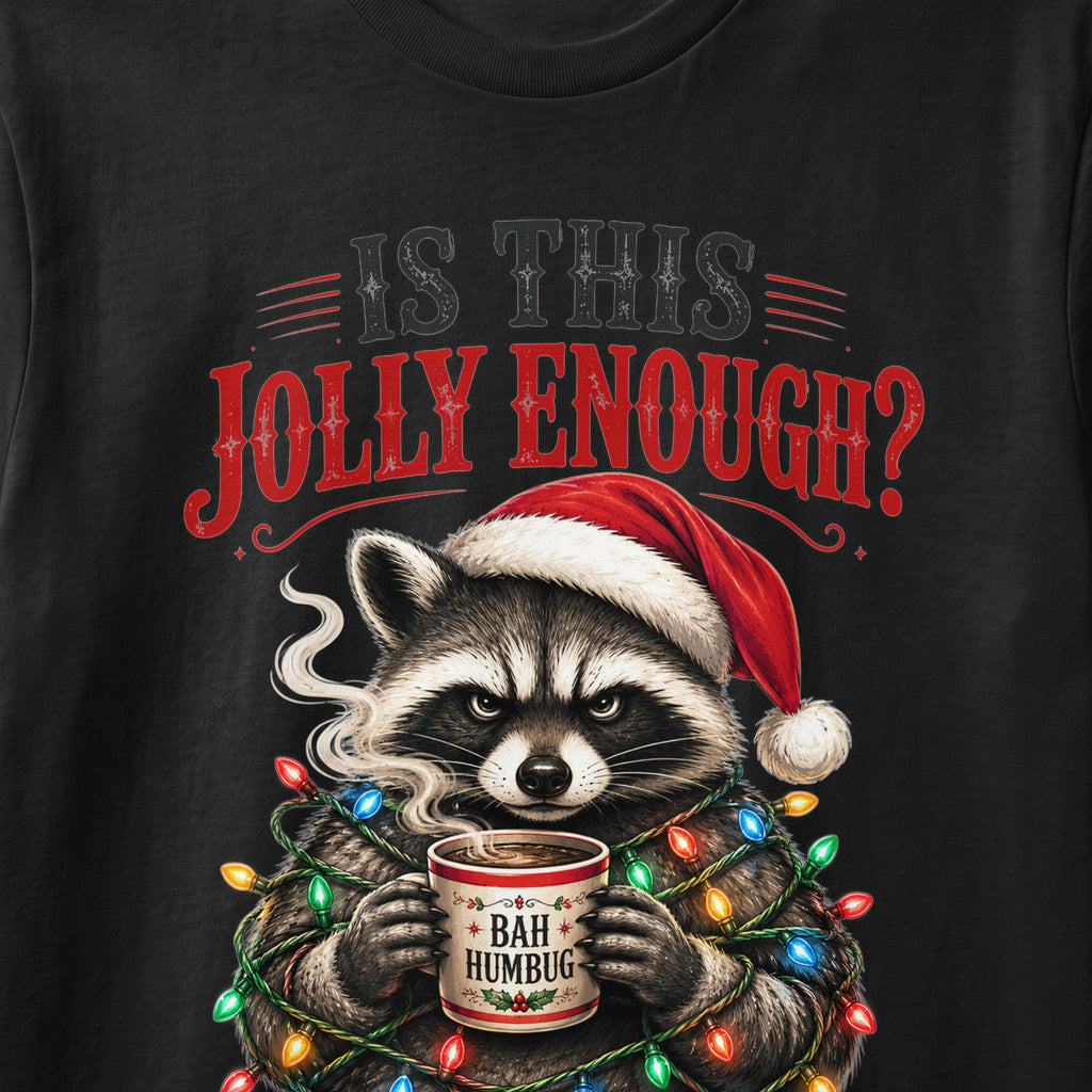 Raccoon in Santa hat, wrapped in Christmas lights, holding "BAH HUMBUG" mug.