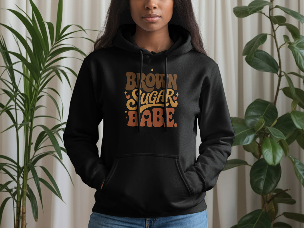 Black hoodie with "Brown Sugar Babe" text in retro font and decorative hearts.