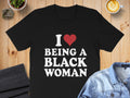 Black t-shirt with text "I ❤️ BEING A BLACK WOMAN"
