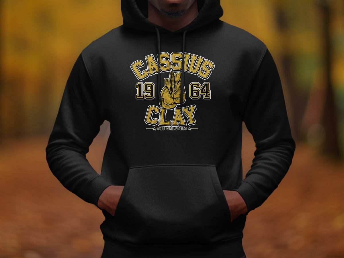 Black hoodie with "Cassius 1964 Clay - The Greatest" text and boxing gloves.