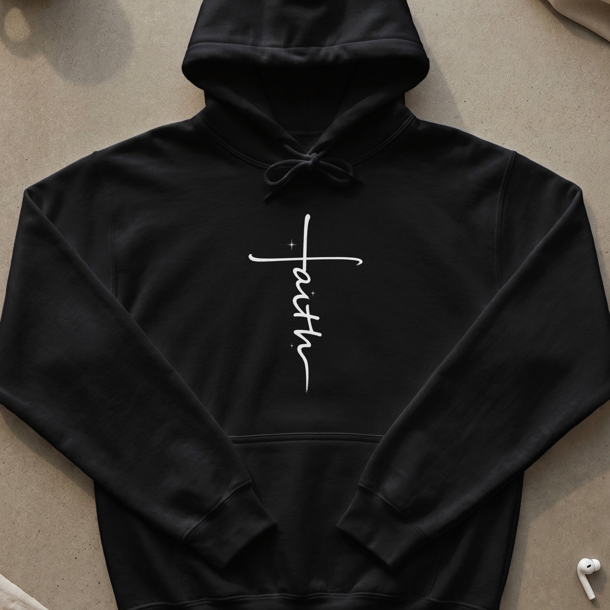 Black hoodie with white "faith" text on a cross.