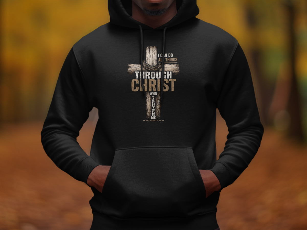 Black hoodie with a cross design featuring text from Philippians 4:13.