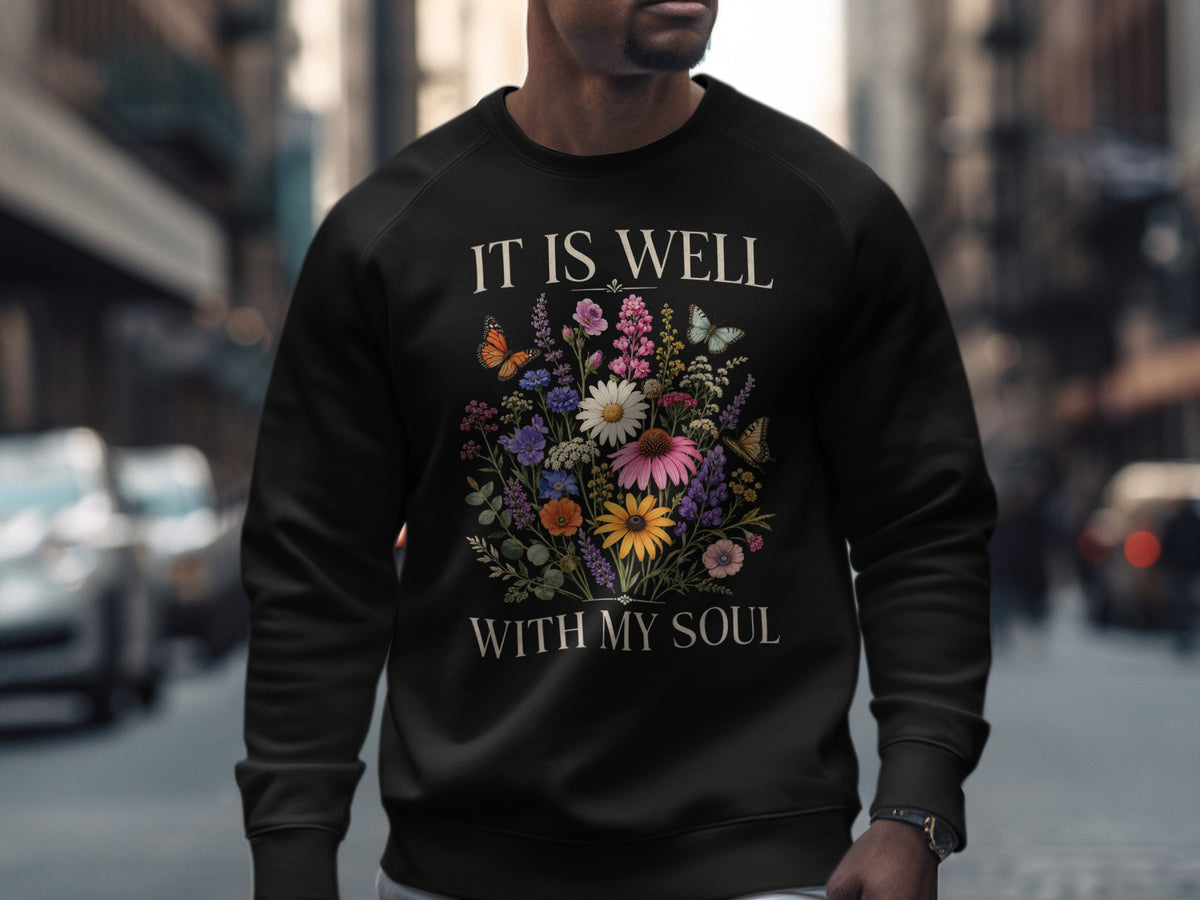 Black sweatshirt with "IT IS WELL WITH MY SOUL" and floral design.
