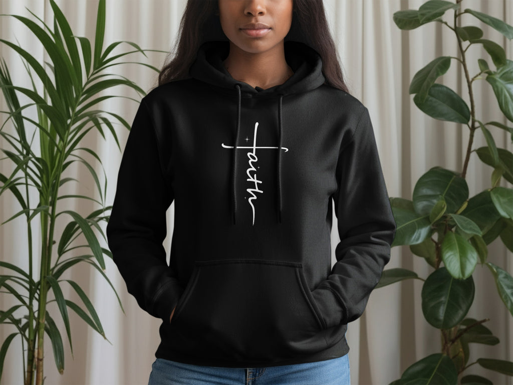 Black hoodie with white "Faith" text across a subtle cross design.