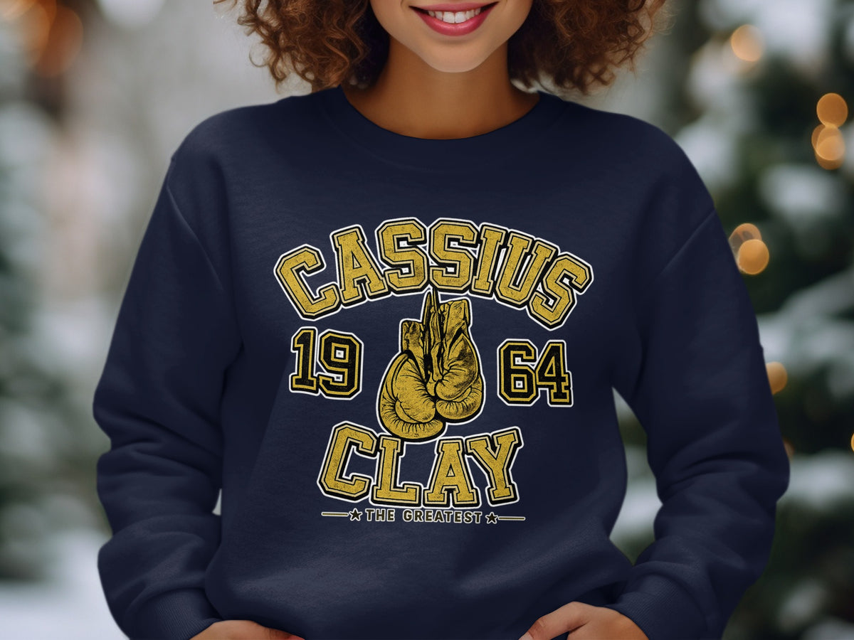 Cassius Clay 1964 boxing gloves graphic with "The Greatest" text.