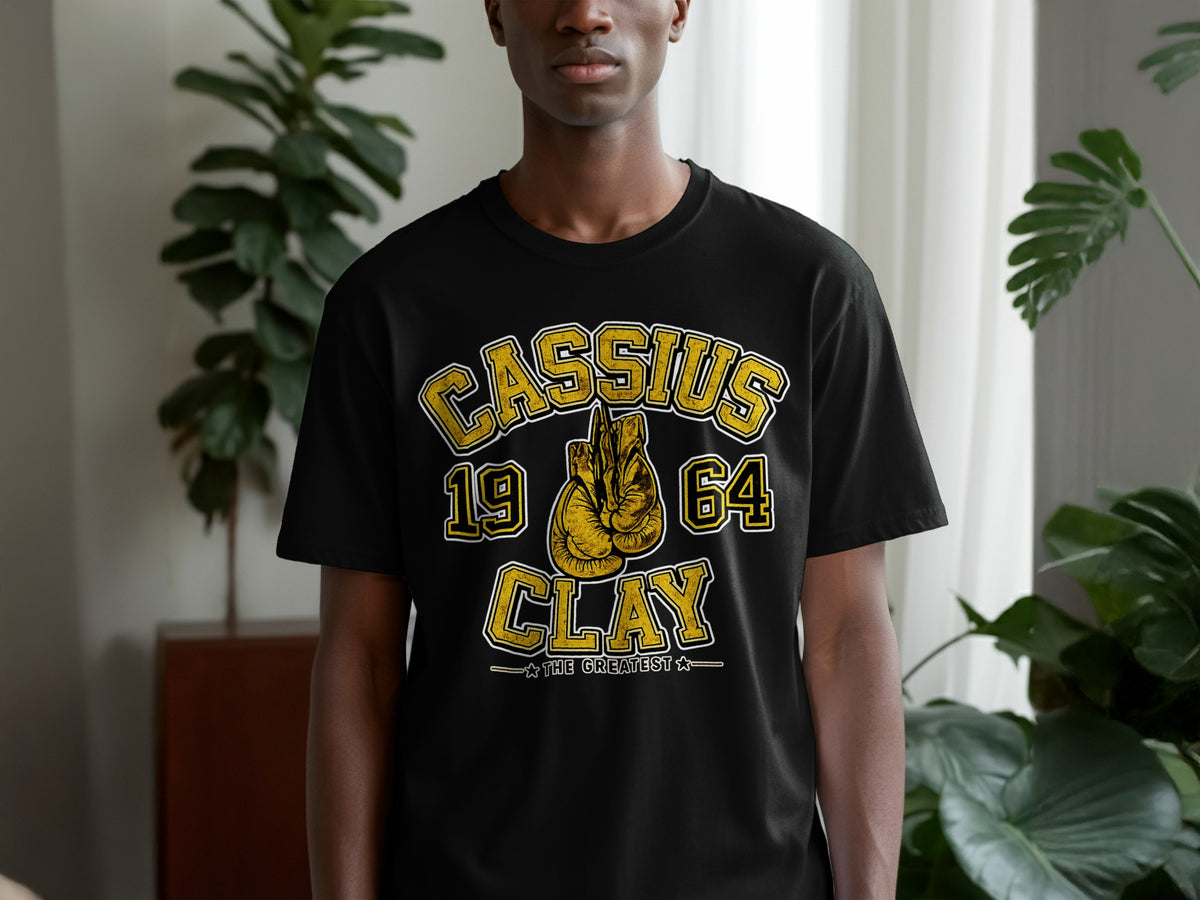 Black t-shirt with "Cassius 19 64 Clay The Greatest" text and boxing gloves.