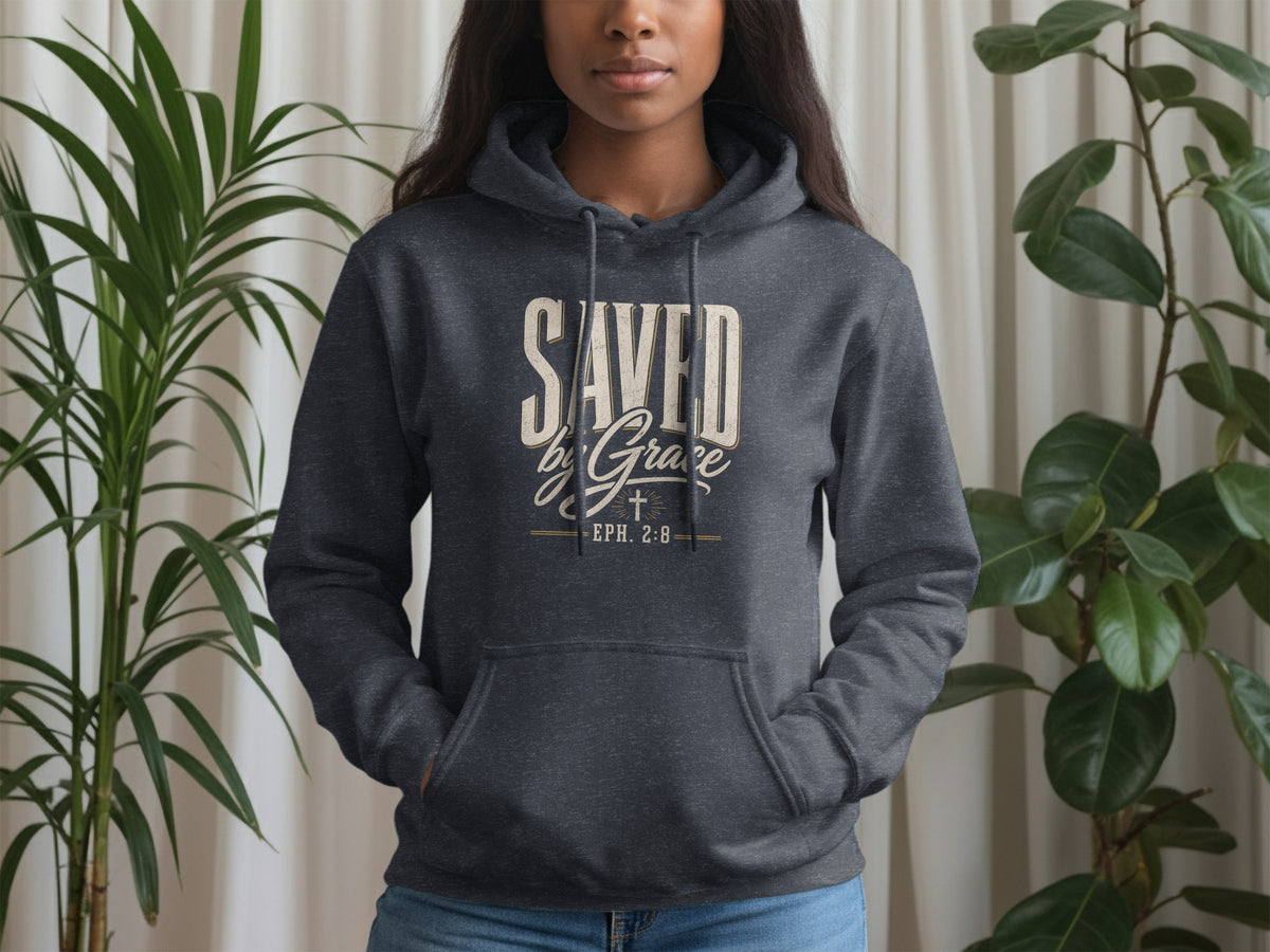 Dark grey hoodie with "SAVED by Grace EPH. 2:8" text and a cross symbol.