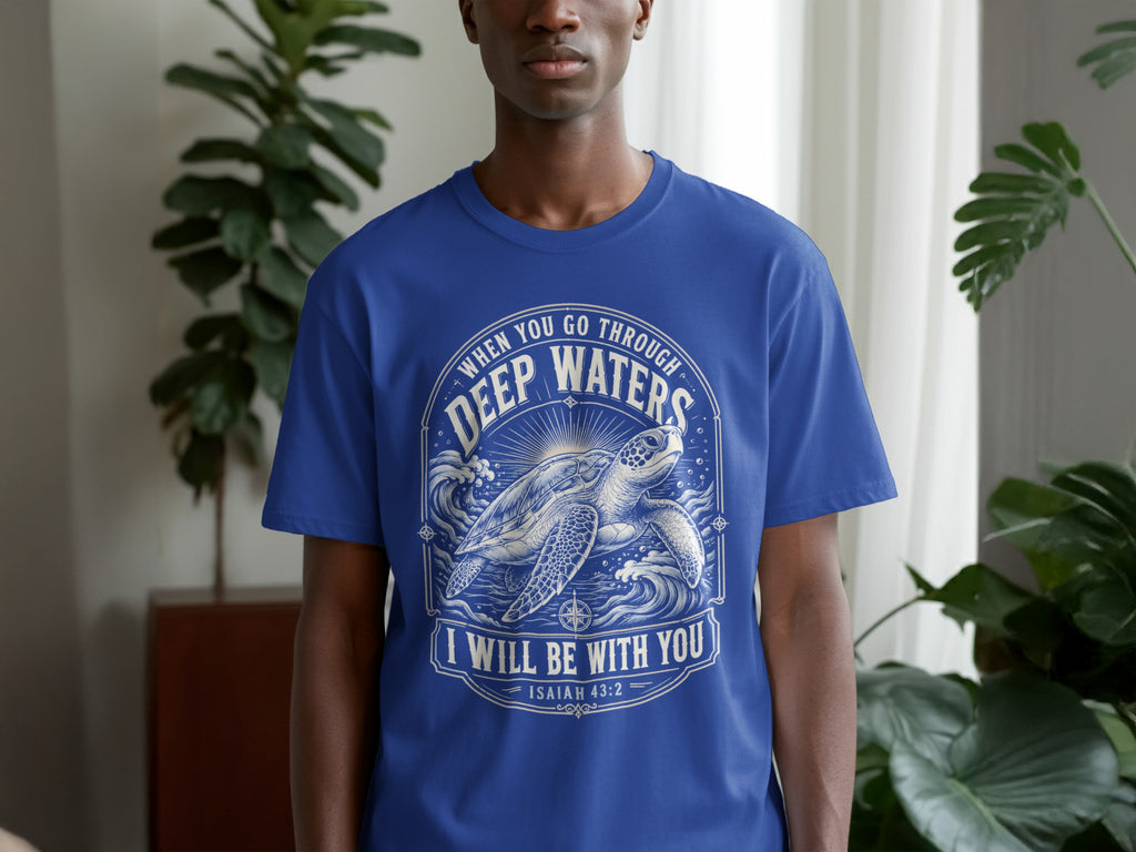 Blue t-shirt with sea turtle graphic and text "WHEN YOU GO THROUGH DEEP WATERS I WILL BE WITH YOU ISAIAH 43:2".