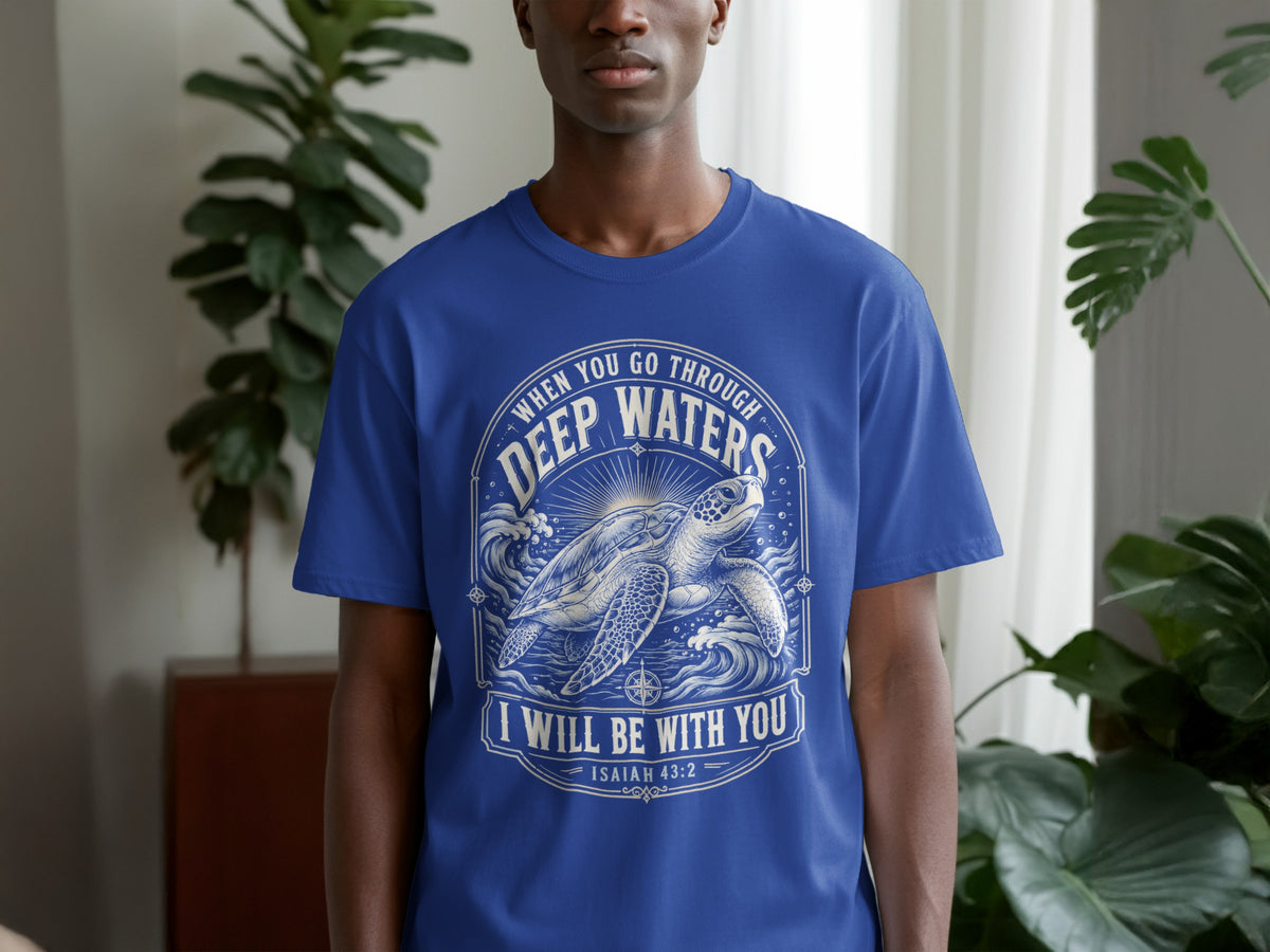 Blue t-shirt with sea turtle graphic and text "WHEN YOU GO THROUGH DEEP WATERS I WILL BE WITH YOU ISAIAH 43:2".