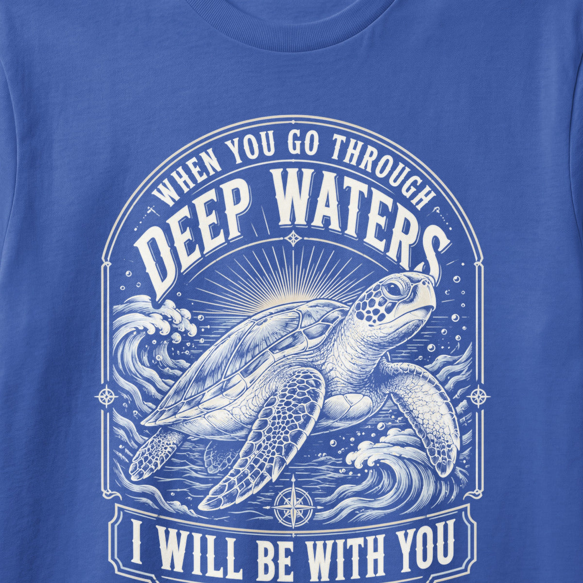 Blue t-shirt with graphic of a sea turtle and text "When you go through deep waters I will be with you."