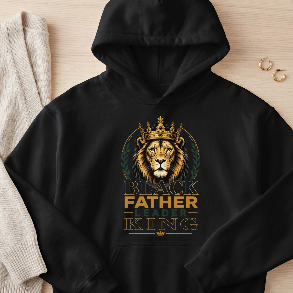 Black hoodie with lion king design and text "BLACK FATHER LEADER KING".