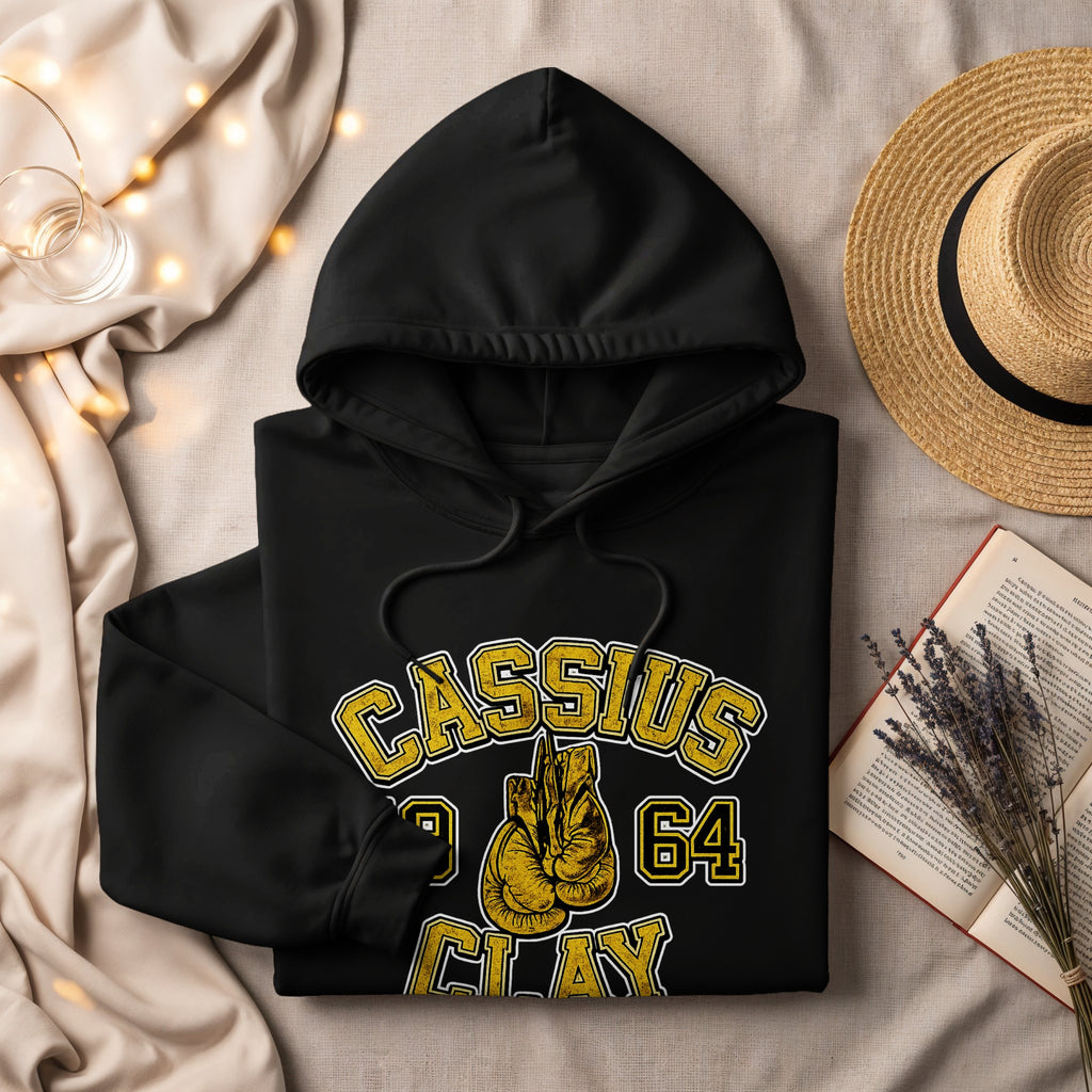 Black hoodie with "Cassius Clay 1964" text and boxing gloves graphic.