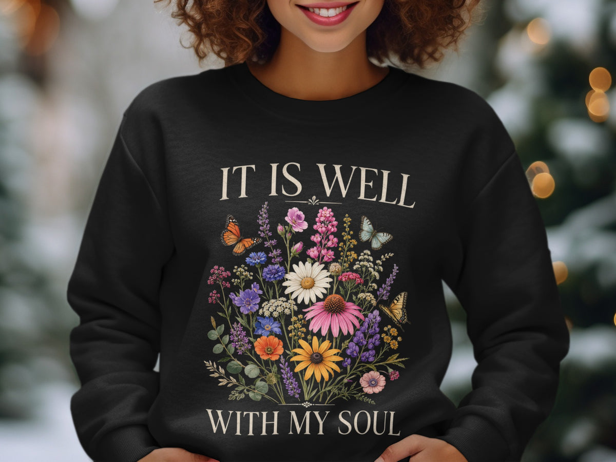 Black sweatshirt with "IT IS WELL WITH MY SOUL" text and floral butterfly design.