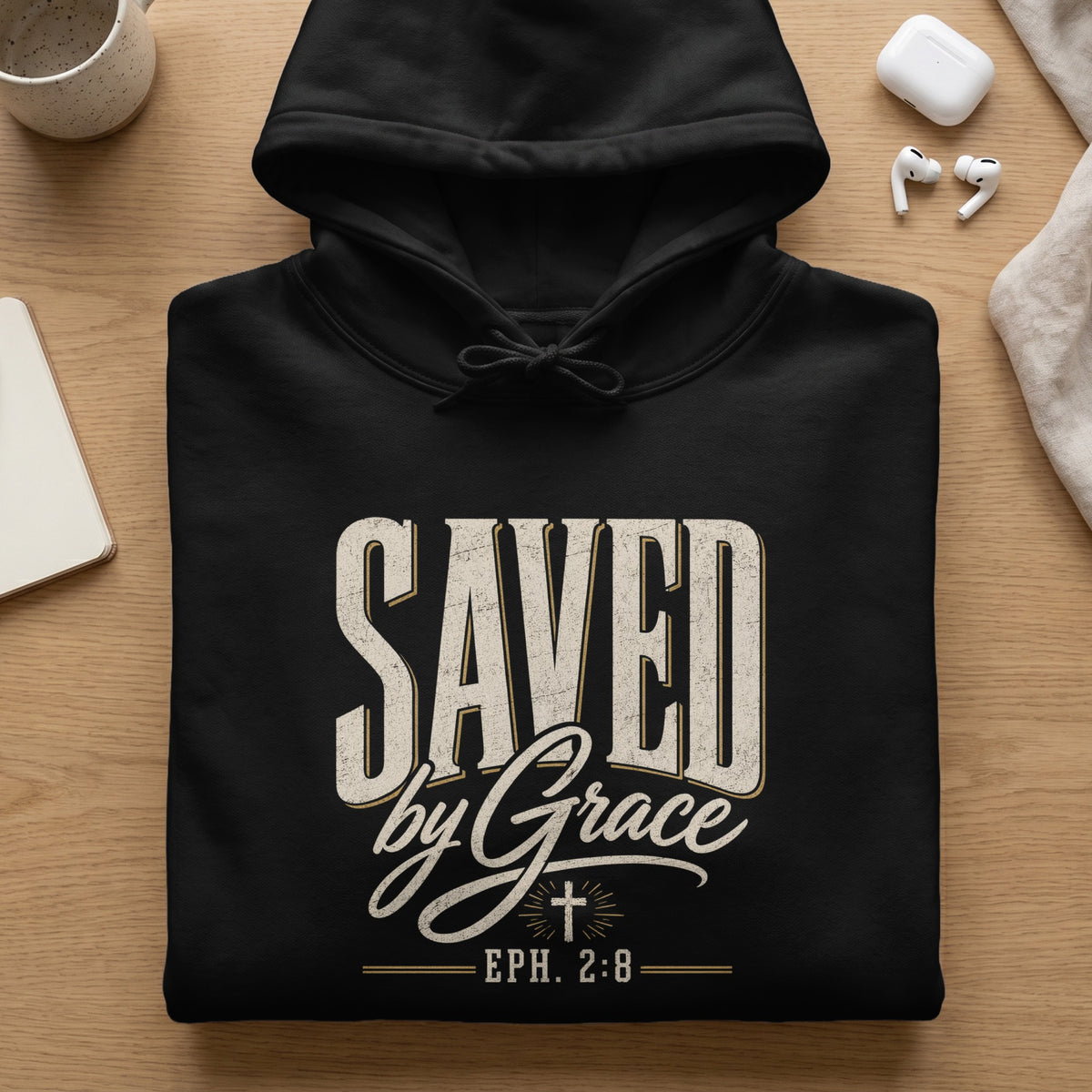 Black hoodie with distressed text "SAVED by Grace" and "EPH. 2:8".