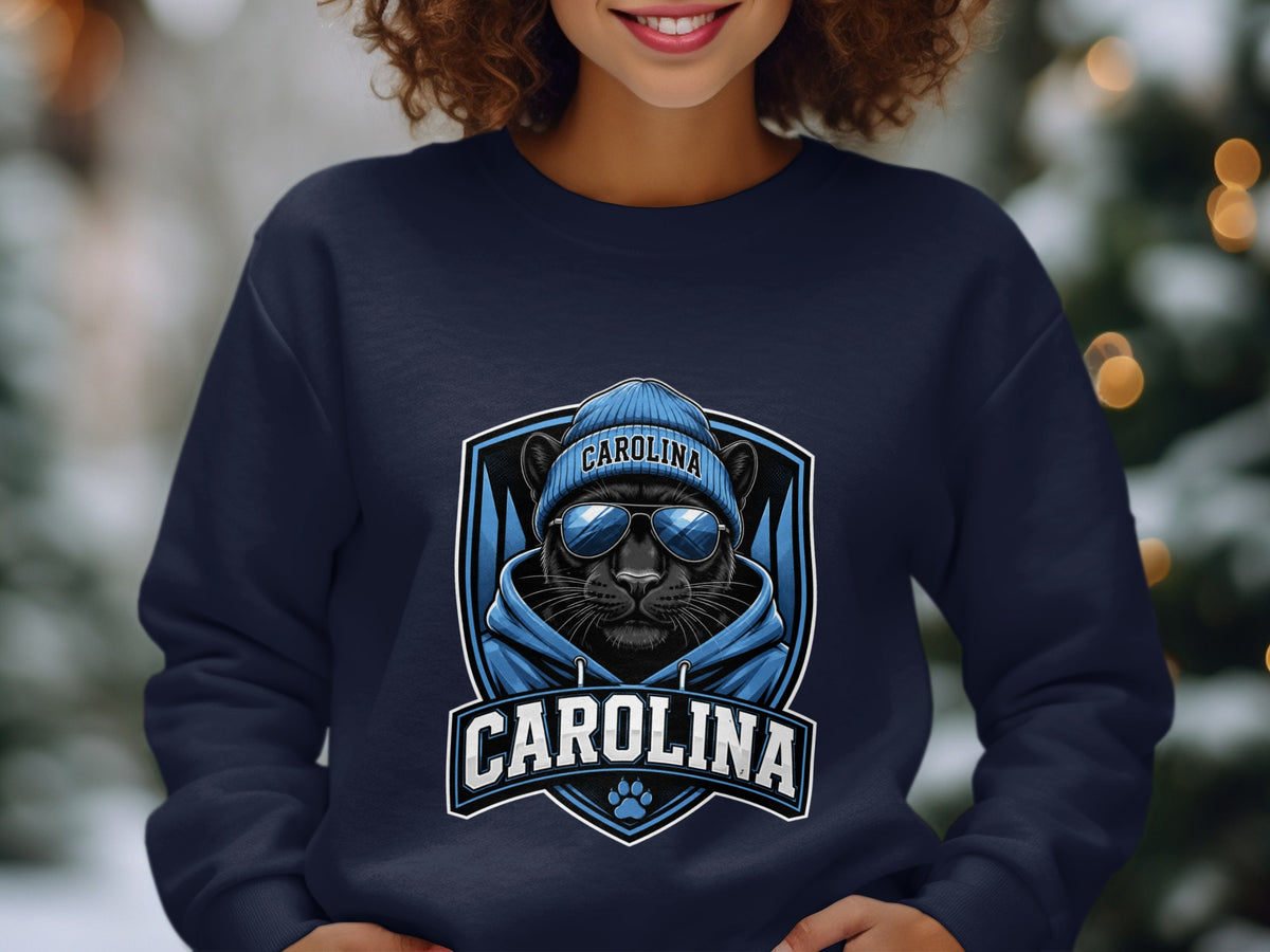 Carolina panther wearing a beanie and sunglasses on a navy sweatshirt.