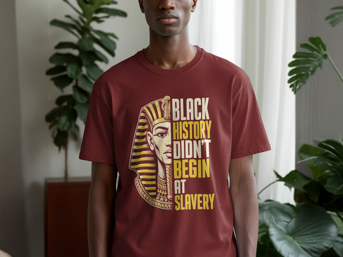 Maroon t-shirt with Egyptian pharaoh graphic and text "BLACK HISTORY DIDN'T BEGIN AT SLAVERY".