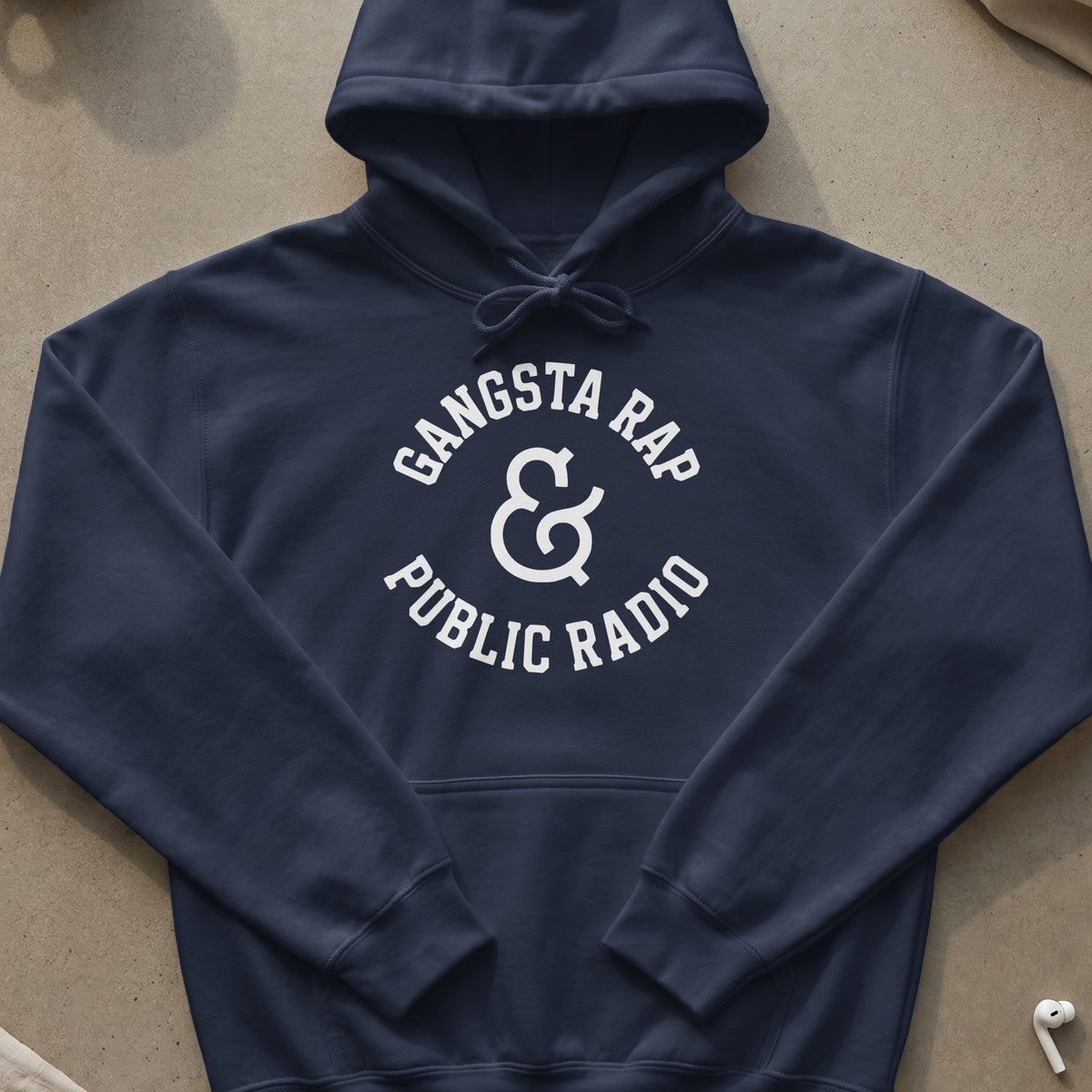 Navy hoodie with white "Gangsta Rap & Public Radio" text and ampersand.