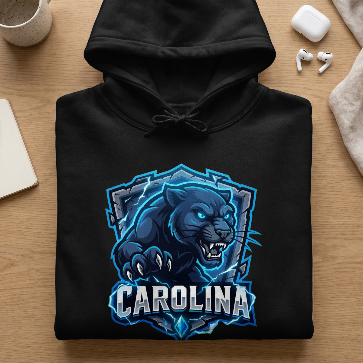 Black hoodie with a blue and gray panther logo and the word "CAROLINA".