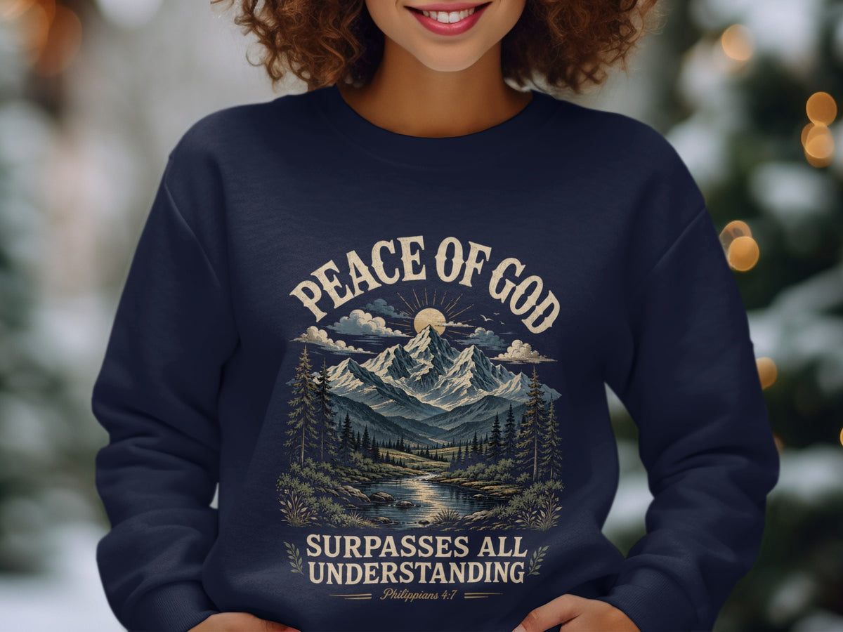 Navy sweatshirt with "Peace of God Surpasses All Understanding Philippians 4:7" and mountain landscape.
