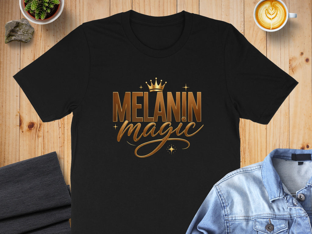 Black t-shirt with "Melanin Magic" in gold lettering and a crown.