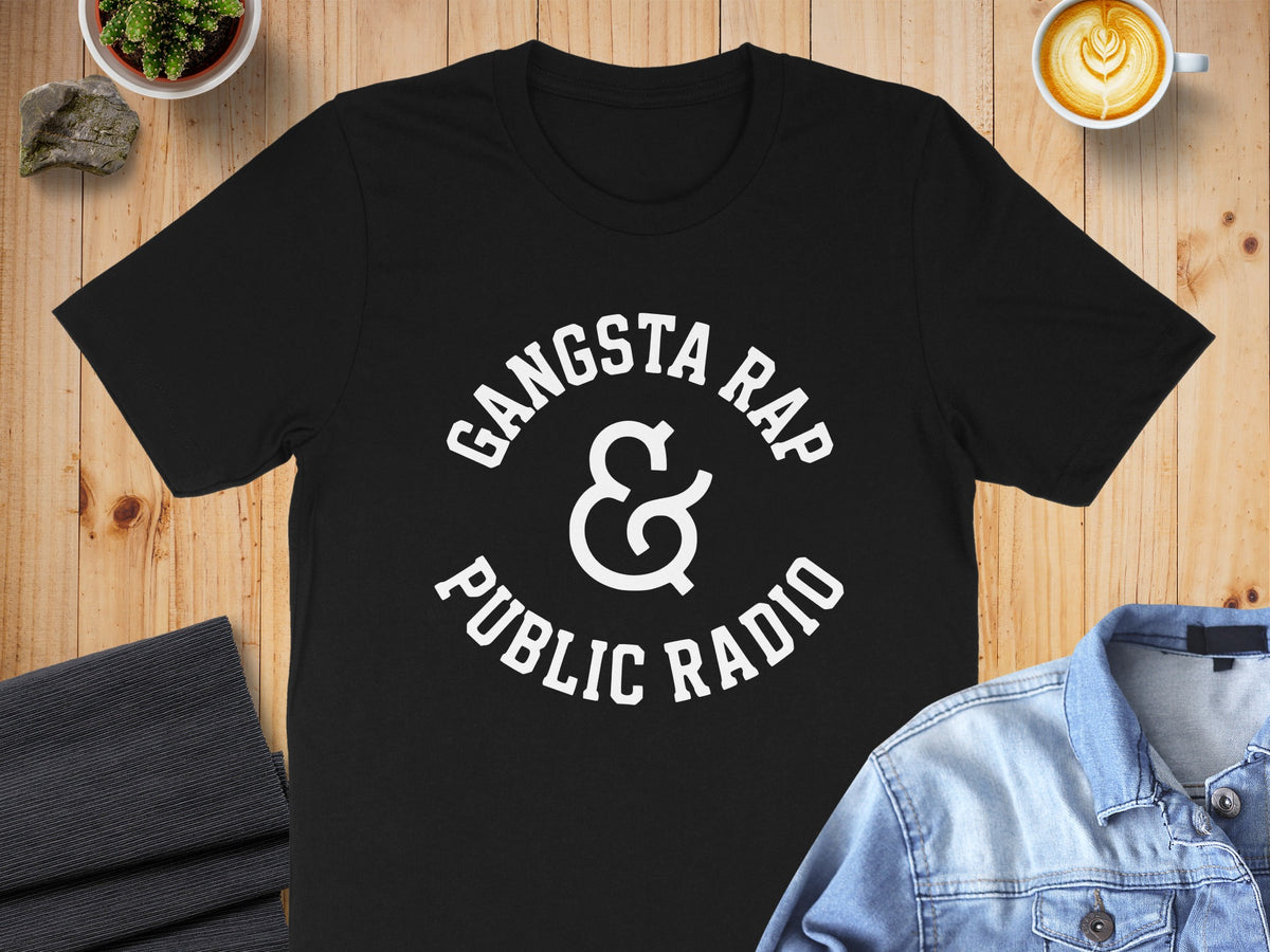 Black t-shirt with "Gangsta Rap & Public Radio" graphic in white text.