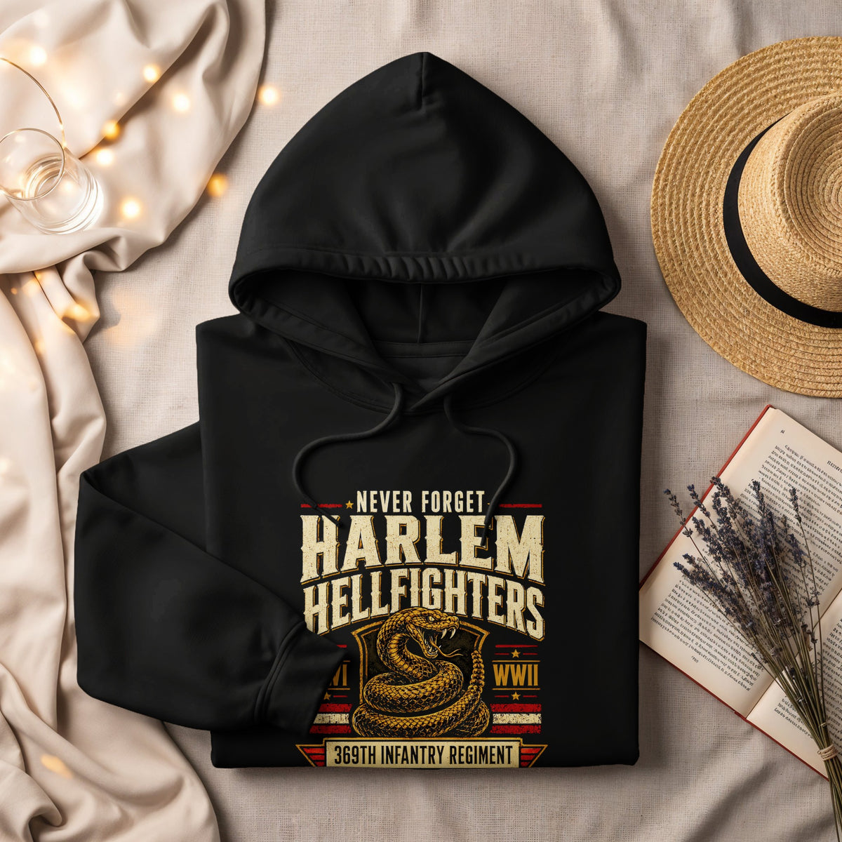 Black hoodie featuring "Never Forget Harlem Hellfighters WWII 369th Infantry Regiment" text.