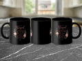 Black mug with floral wreath graphic and text: "Blessed is she who believed that the Lord would fulfill His promises to her. Luke 1:45."