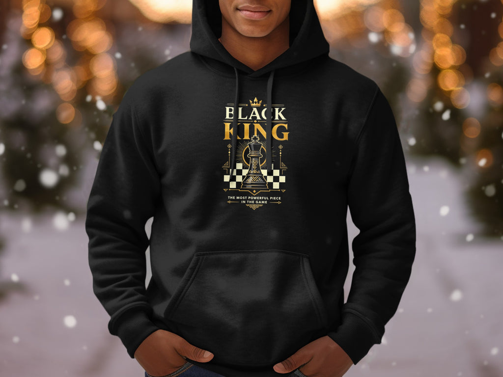 Black King chess piece graphic with text on a black hoodie.