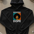 Black hoodie with graphic of woman with afro and text "UNAPOLOGETICALLY DOPE".