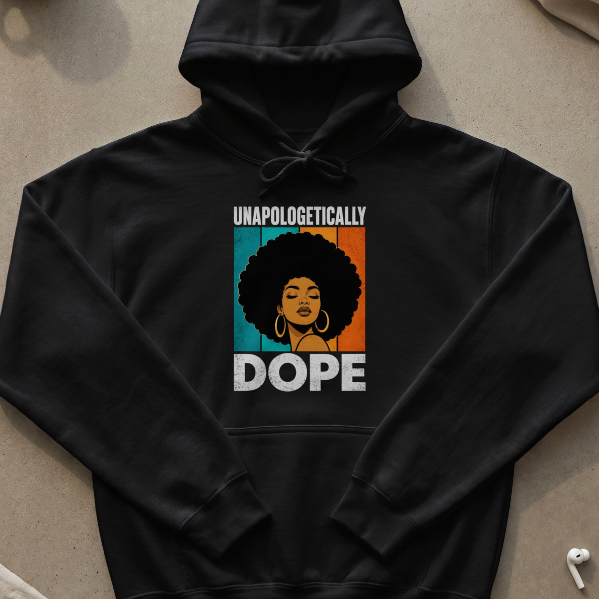 Black hoodie with graphic of woman with afro and text "UNAPOLOGETICALLY DOPE".